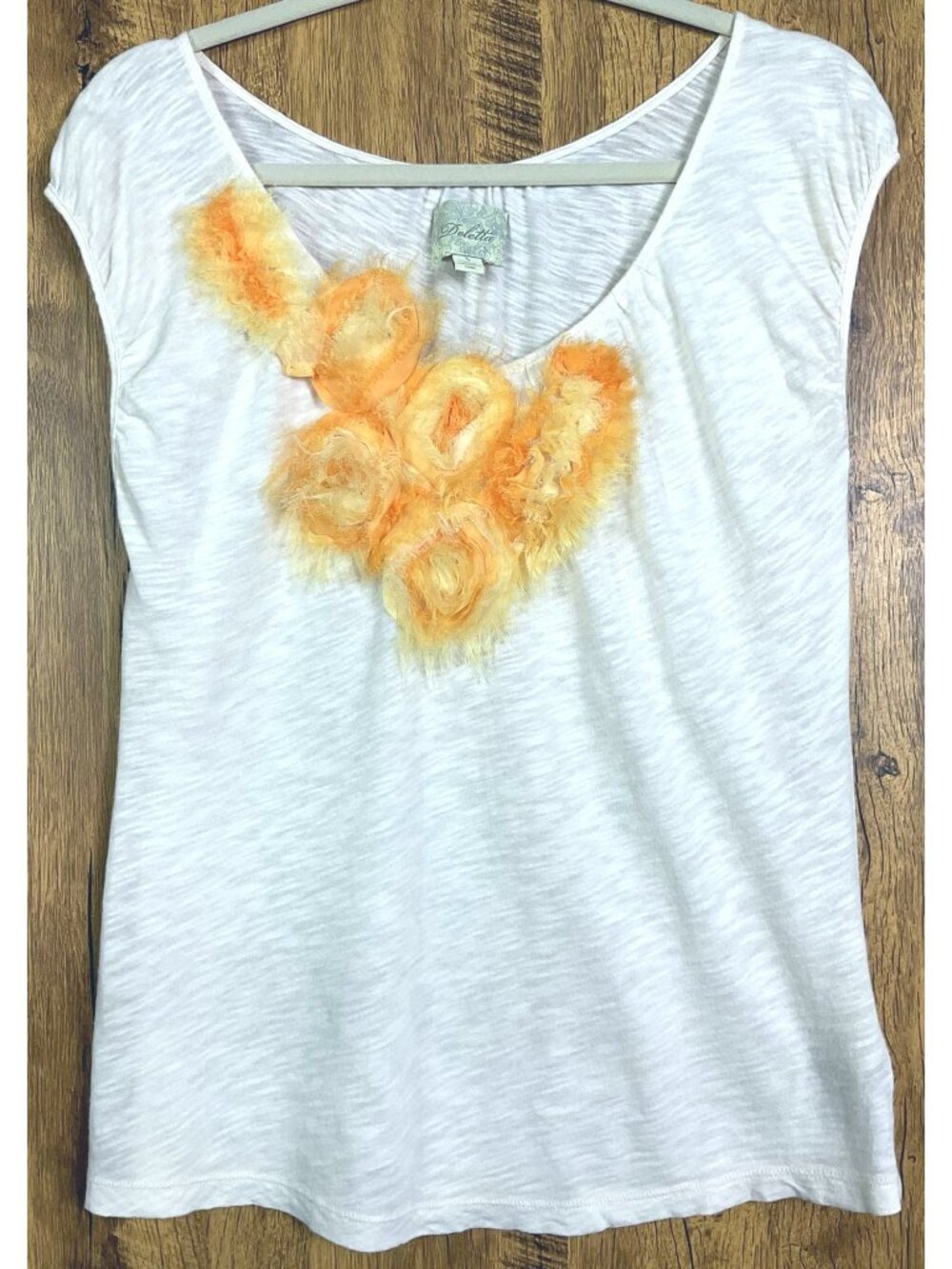 Anthropologie Deletta "Slope Tee" featuring orange chiffon rosette appliqués